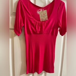 Pink tee with cute detailing! Large( fits smaller)